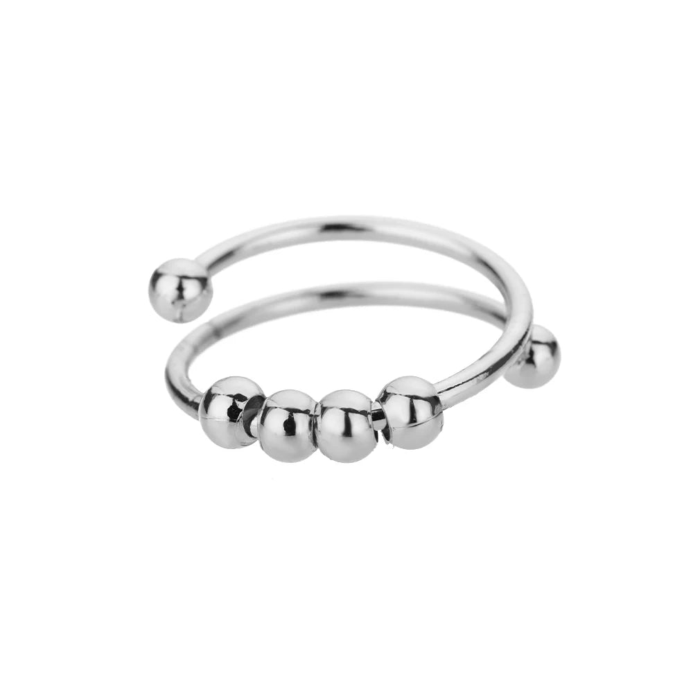 Spinnerring med kuler – diskré fikling for fingrene