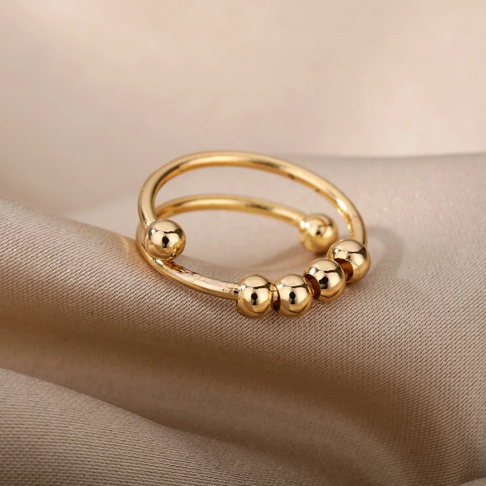 Spinnerring med kuler – diskré fikling for fingrene