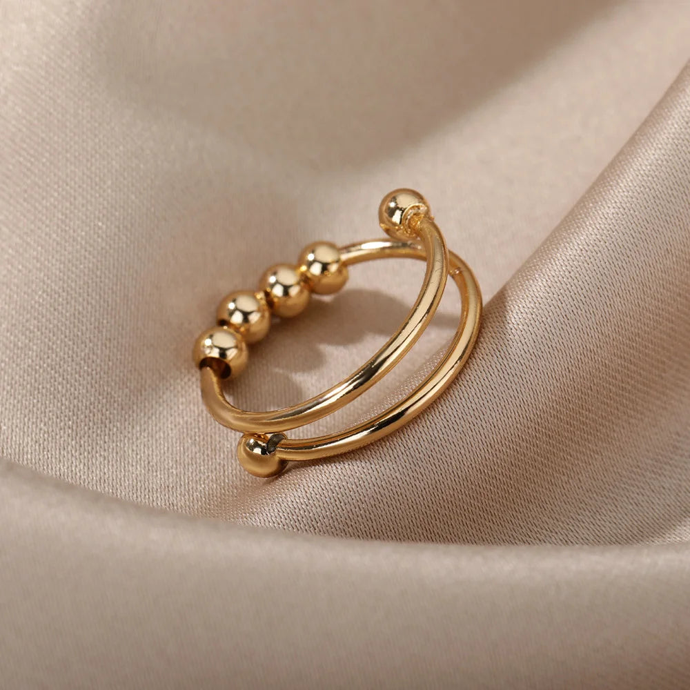 Spinnerring med kuler – diskré fikling for fingrene