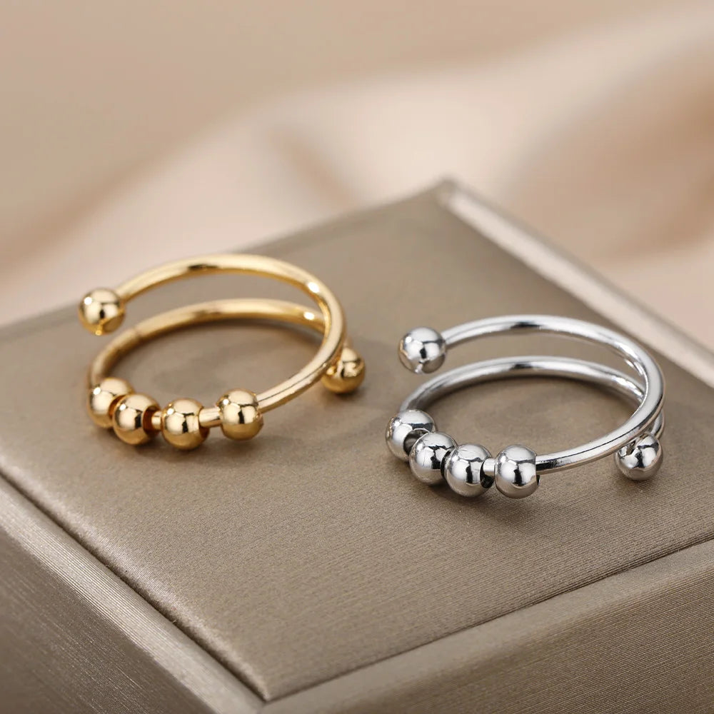 Spinnerring med kuler – diskré fikling for fingrene